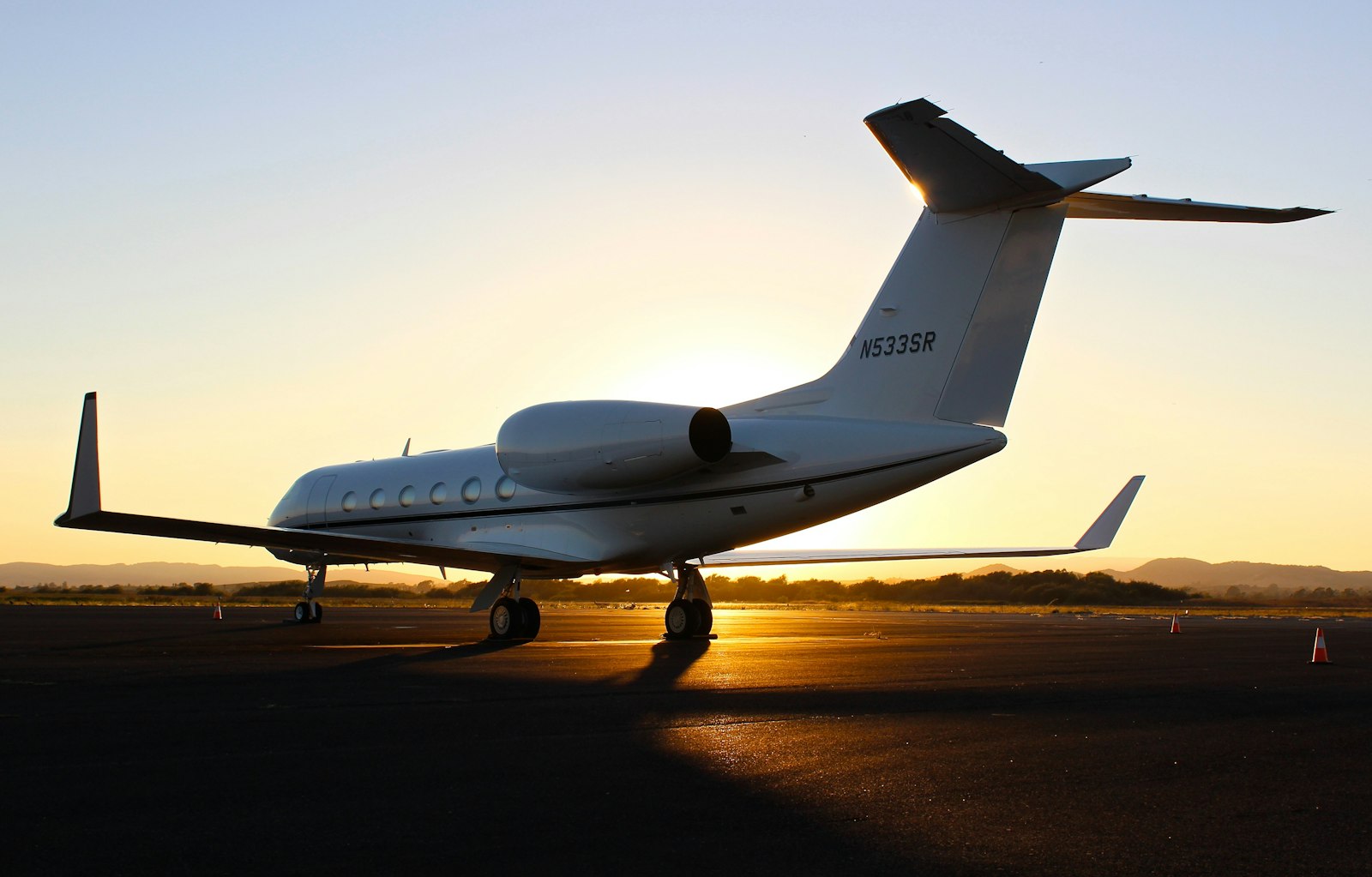 Private jet on the tarmac at dusk